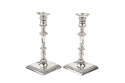 Lot 635 - A pair of silver candlesticks, with gadrooned...