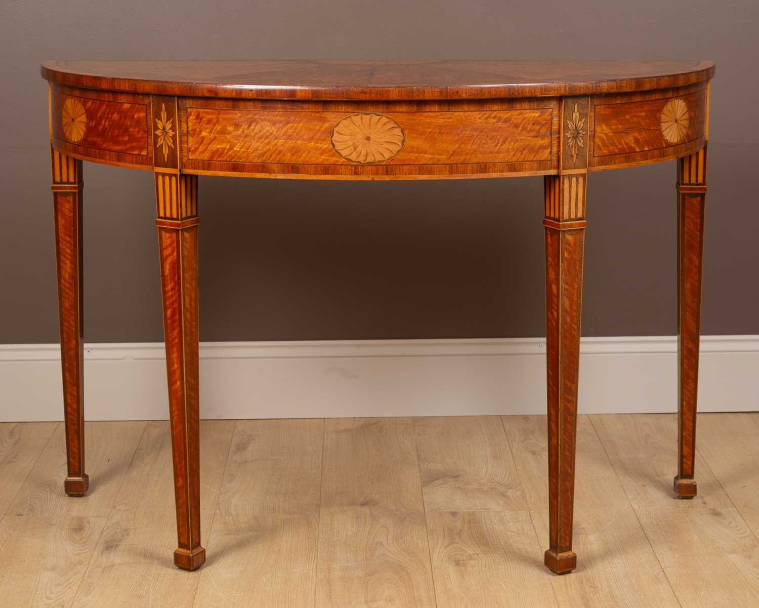Lot 75 - A George III Sheraton satinwood demi-lune side table