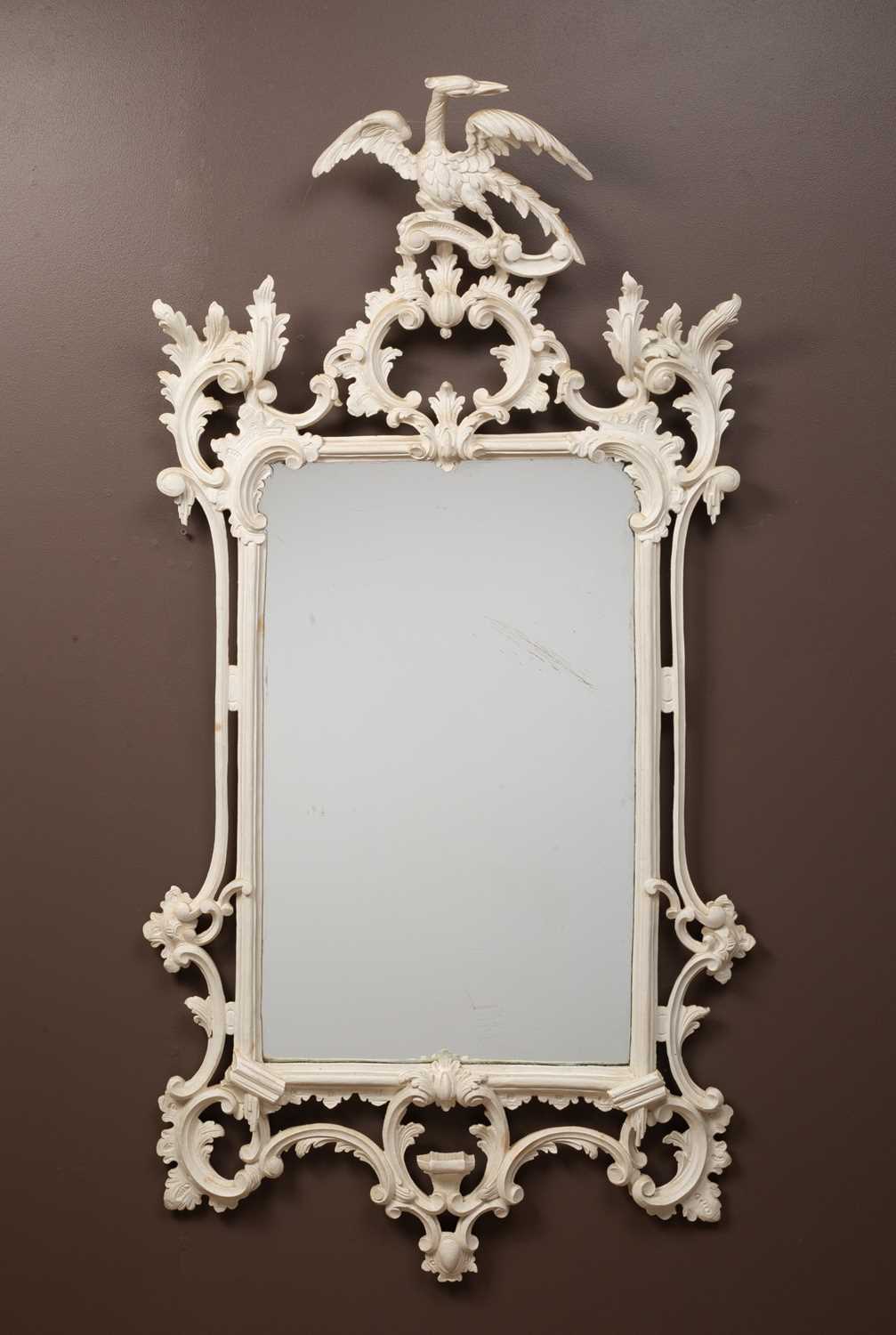 Lot 302 - A Georgian style white painted Rococo wall mirror