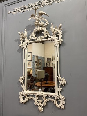 Lot 302 - A Georgian style white painted Rococo wall mirror