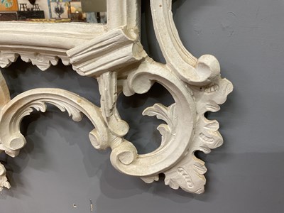 Lot 302 - A Georgian style white painted Rococo wall mirror