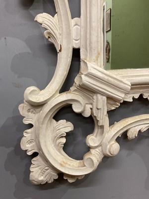 Lot 302 - A Georgian style white painted Rococo wall mirror