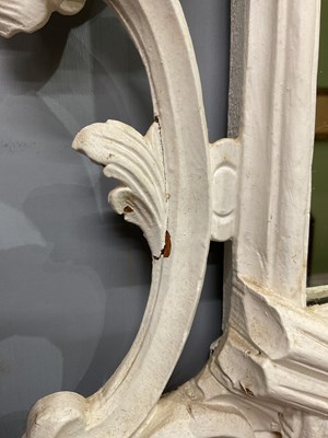 Lot 302 - A Georgian style white painted Rococo wall mirror