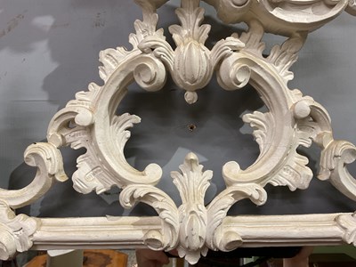 Lot 302 - A Georgian style white painted Rococo wall mirror