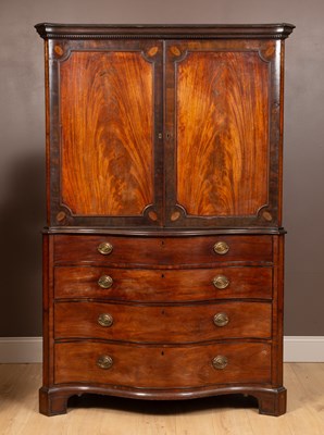 Lot 342 - A George III mahogany serpentine fronted linen press