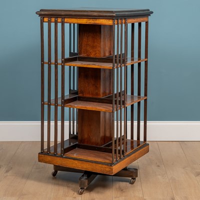 Lot 526 - An Edwardian rosewood inlaid revolving bookcase