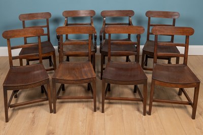 Lot 244 - A set of eight George III mahogany bar backed dining chairs