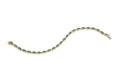 Lot 120 - An emerald and diamond line bracelet, designed...