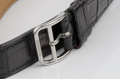 Lot 258 - A 'belt buckle' wristwatch by Hermès, the...