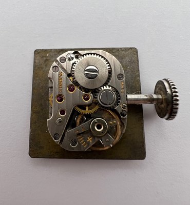 Lot 258 - A 'belt buckle' wristwatch by Hermès, the...