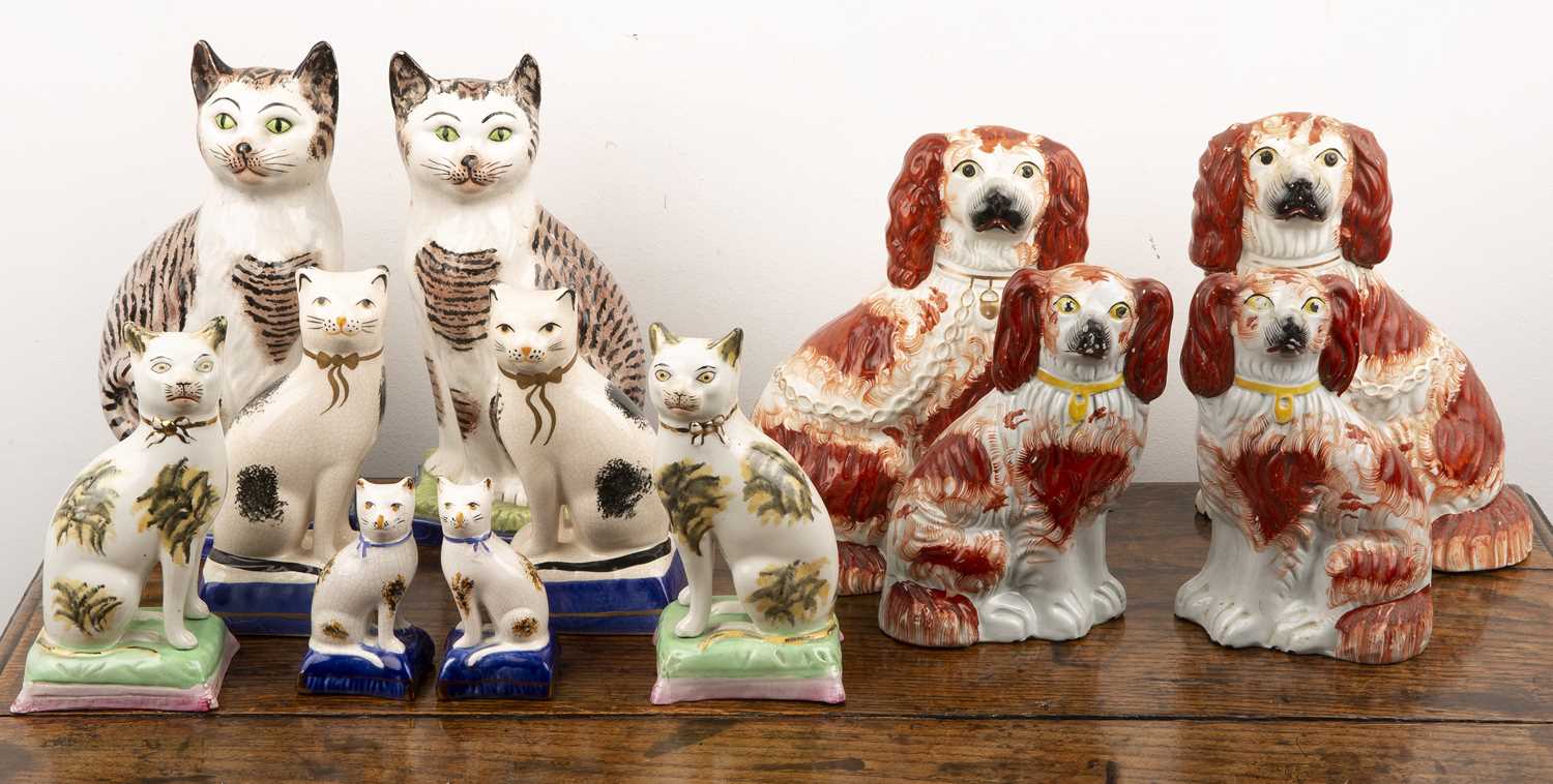 Lot 298 - Group of Staffordshire pottery cats and dogs...