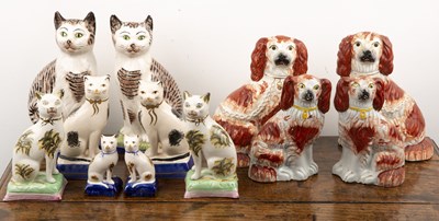 Lot 298 - Group of Staffordshire pottery cats and dogs...