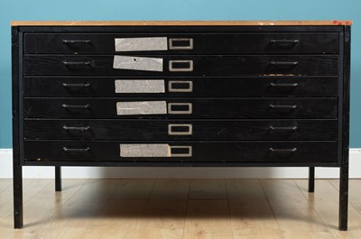 Lot 570 - A black painted plan chest