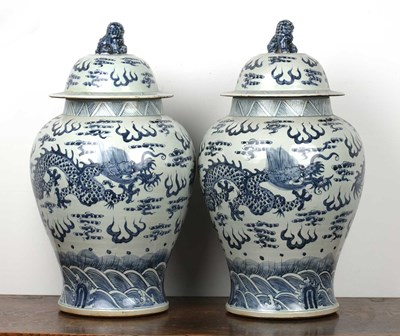Lot 7 - A pair of Chinese blue and white vases and covers