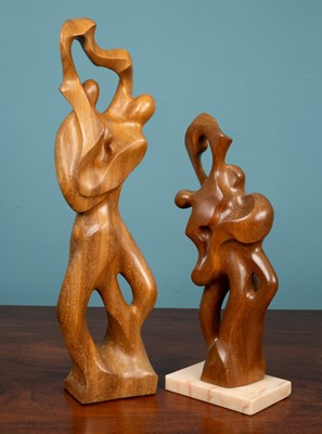 Lot 80 - Two wooden abstract sculptures depicting figures dancing