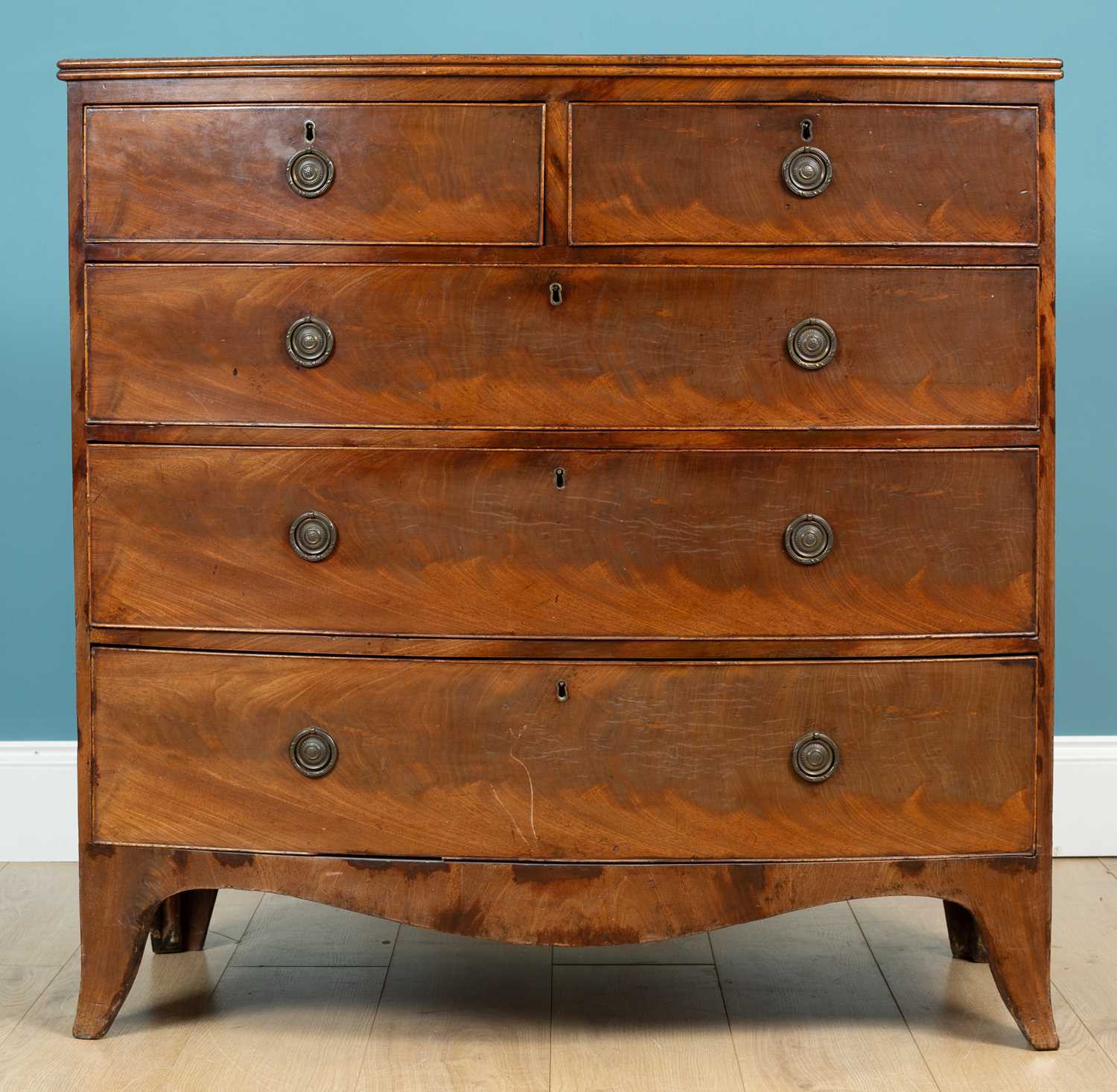 Lot 141 - A Regency mahogany bow front chest of two...