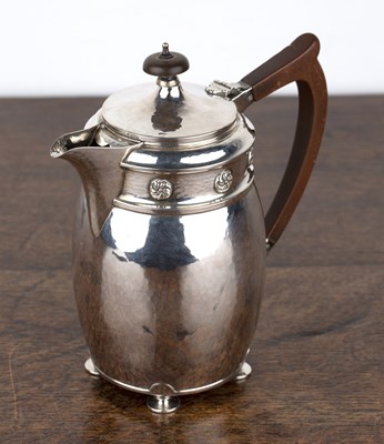 Lot 418 - Arts and Crafts silver teapot With beaten...