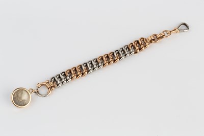 Lot 45 - A two colour precious metal chain fob, of...