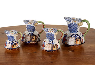 Lot 308 - Graduated set of four polychrome jugs...