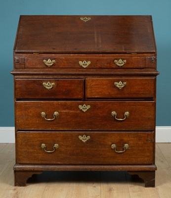 Lot 573 - A 17th century oak bureau