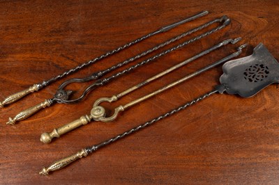 Lot 393 - A set of steel fire irons together with a further brass set of tongs