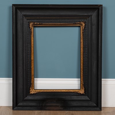 Lot 395 - An ebonised frame with a wiggle-work banding