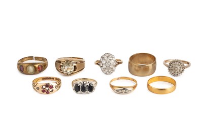 Lot 288 - A collection of rings, comprising a red stone...