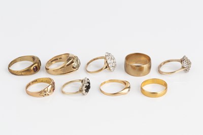 Lot 288 - A collection of rings, comprising a red stone...