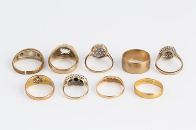 Lot 288 - A collection of rings, comprising a red stone...