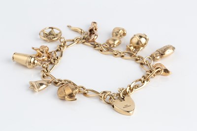 Lot 62 - A charm bracelet, the 9ct gold figaro-link...