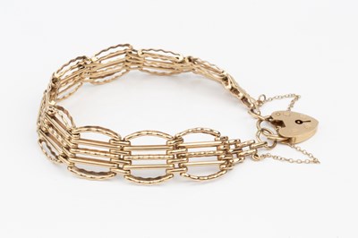 Lot 104 - A 9ct gold fancy gate-link bracelet, with...