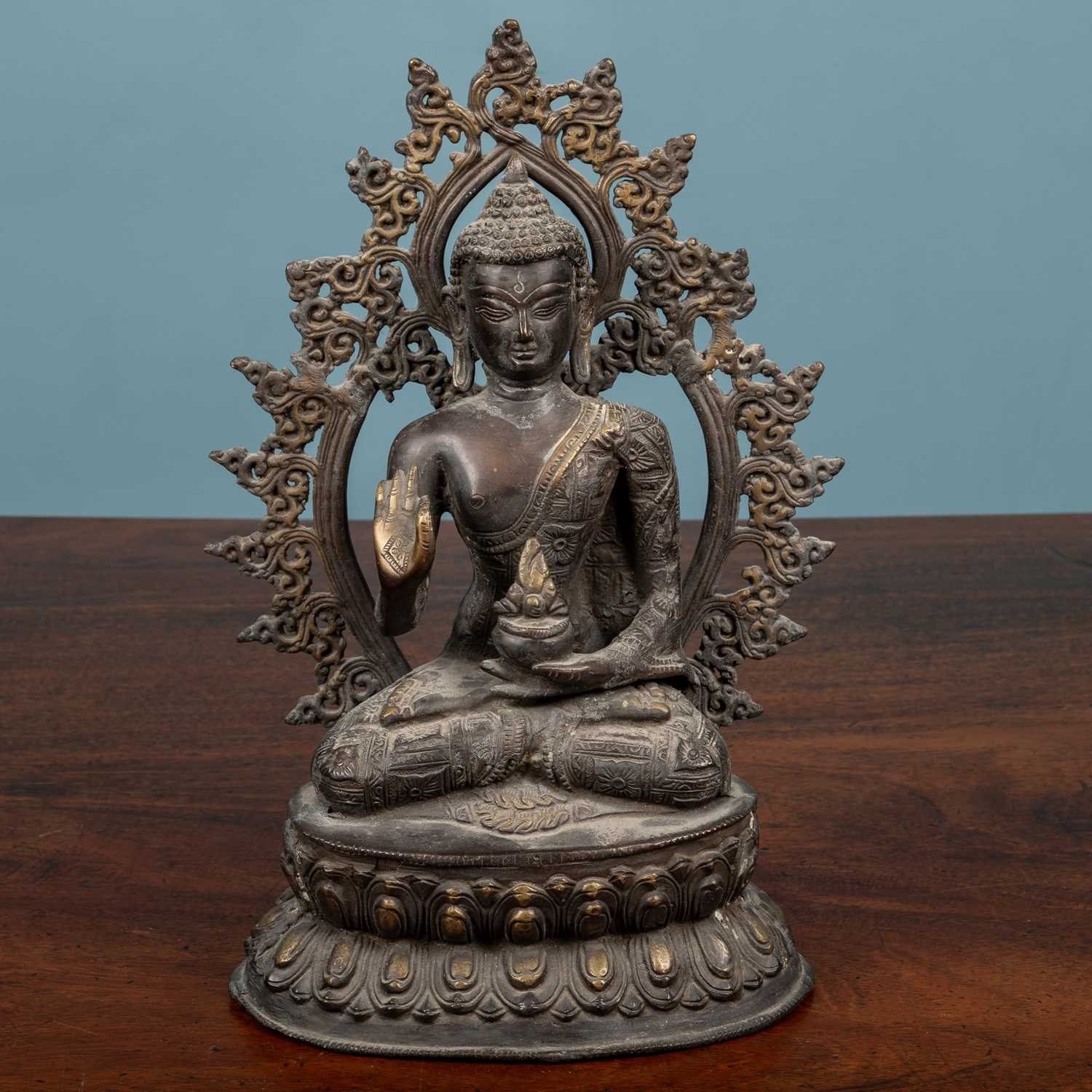 Lot 567 A SintoTibetan kneeling buddha
