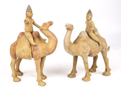 Lot 151 - A pair of Chinese Tang style camels with...