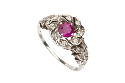 Lot 118 - A ruby and diamond cluster ring, the circular...