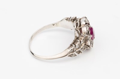 Lot 118 - A ruby and diamond cluster ring, the circular...