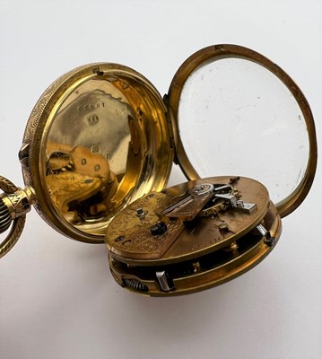 Lot 241 - An 18ct gold open face fob watch, the floral...