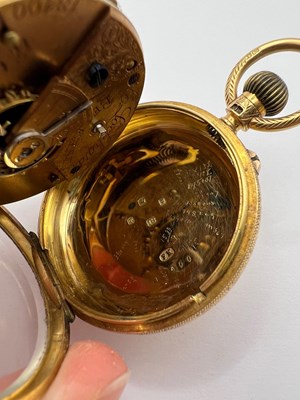 Lot 241 - An 18ct gold open face fob watch, the floral...
