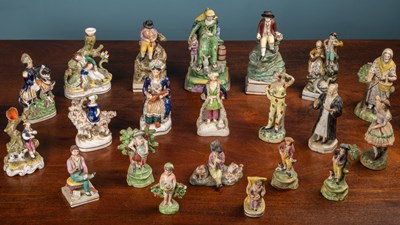 Lot 431 - A collection of twenty one Staffordshire figures and figure groups