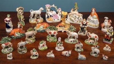 Lot 25 - A collection of Staffordshire figures