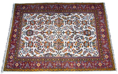 Lot 699 - An indo Oushak design cream ground carpet