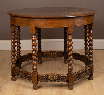 Lot 27 - A circular oak centre table in the Jacobean style