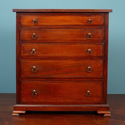 Lot 460 - An antique mahogany table top chest of five graduated drawers