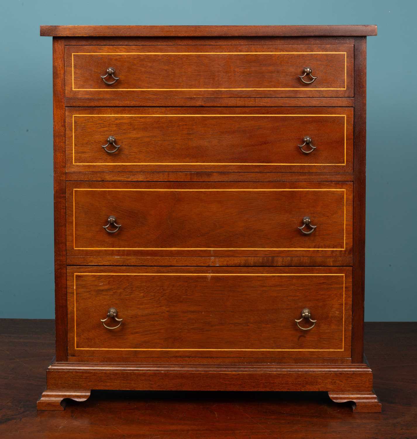 Lot 461 - A mahogany table top chest of four drawers