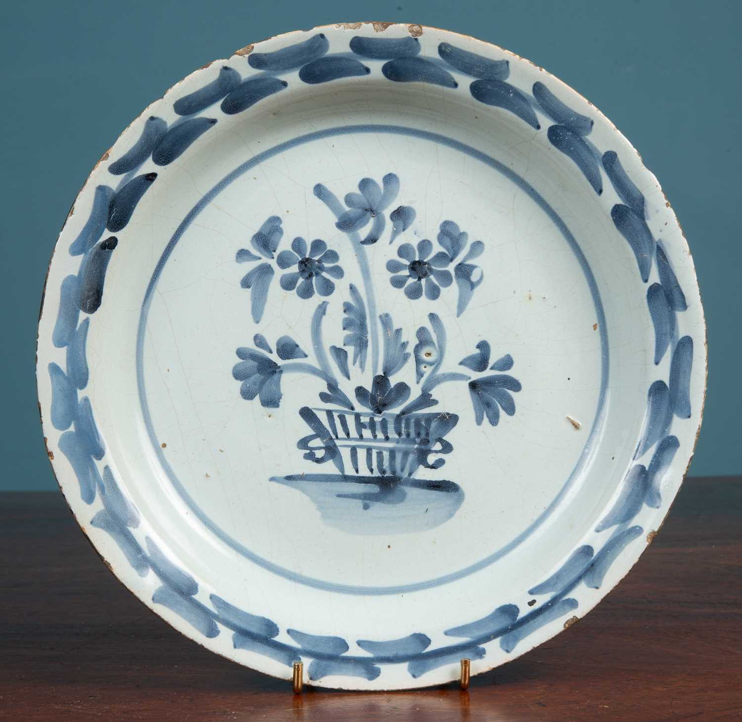 Lot 381 - An 18th century English delftware plate