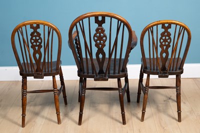 Lot 489 - A set of three wheel back chairs, a scumbled chest, and an Edwardian mahogany drop leaf table