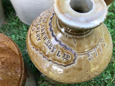 Lot 667 - A group of seven stoneware bottle and jars of local interest