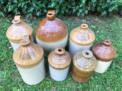 Lot 667 - A group of seven stoneware bottle and jars of local interest