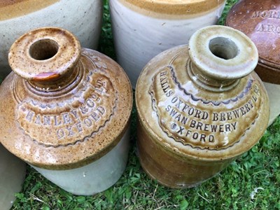 Lot 667 - A group of seven stoneware bottle and jars of local interest