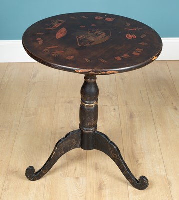 Lot 410 - An ebonised occasional table