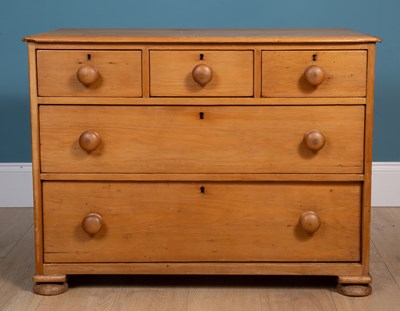 Lot 493 - A 20th century pine chest of three short over two long drawers